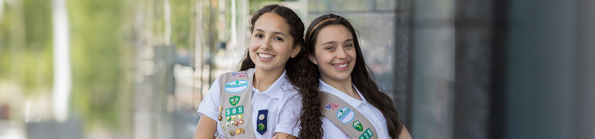  girl scout ambassador high school girl in school wearing sash with highest awards pins 